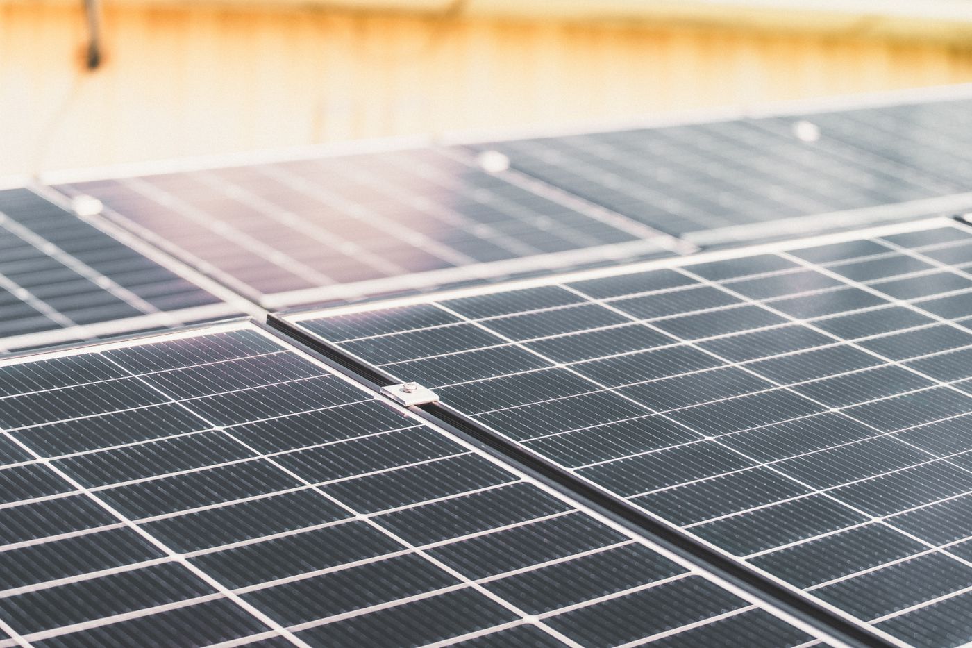 Close detail of a rooftop solar array in full sun